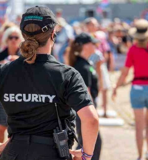 a-woman-in-a-security-uniform-at-an-event